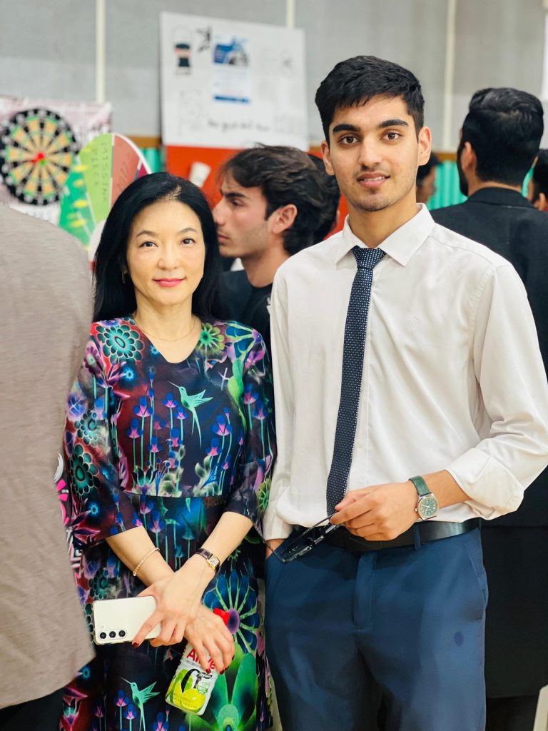 Student with a faculty member at a campus event