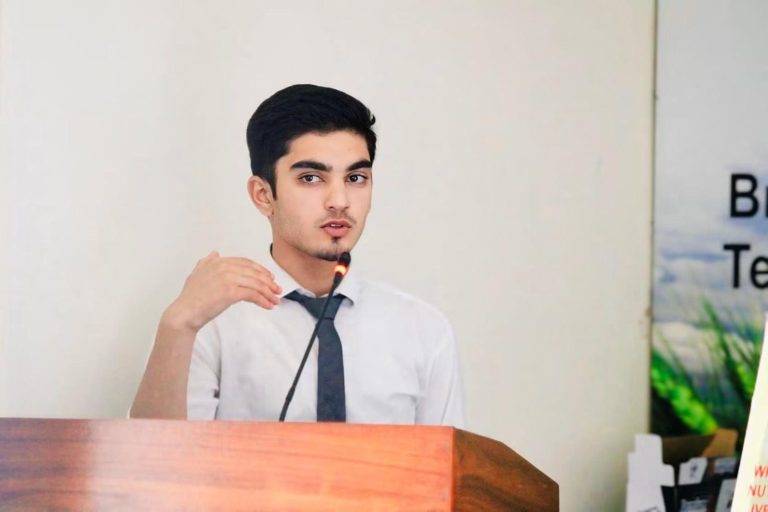 Student speaking at a podium