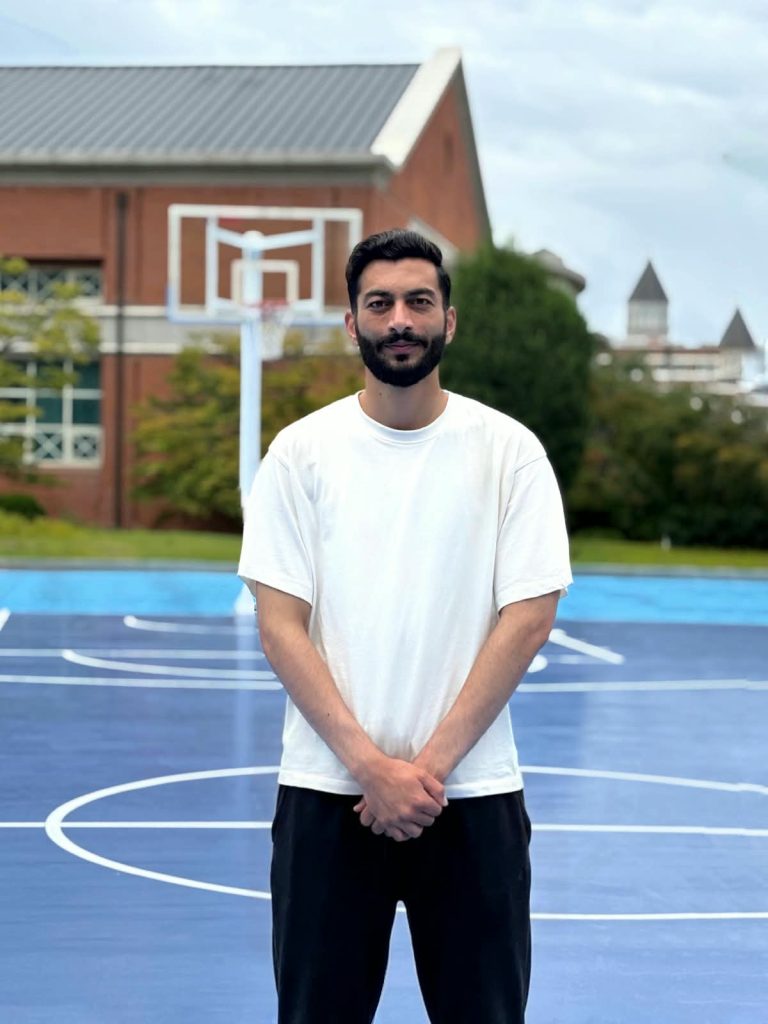 Syed Amir Ali Shah standing on a campus basketball court in Korea